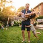 Man enjoying time with his children after Testosterone Replacement Therapy, showing improved energy, muscle strength, and quality of life.
