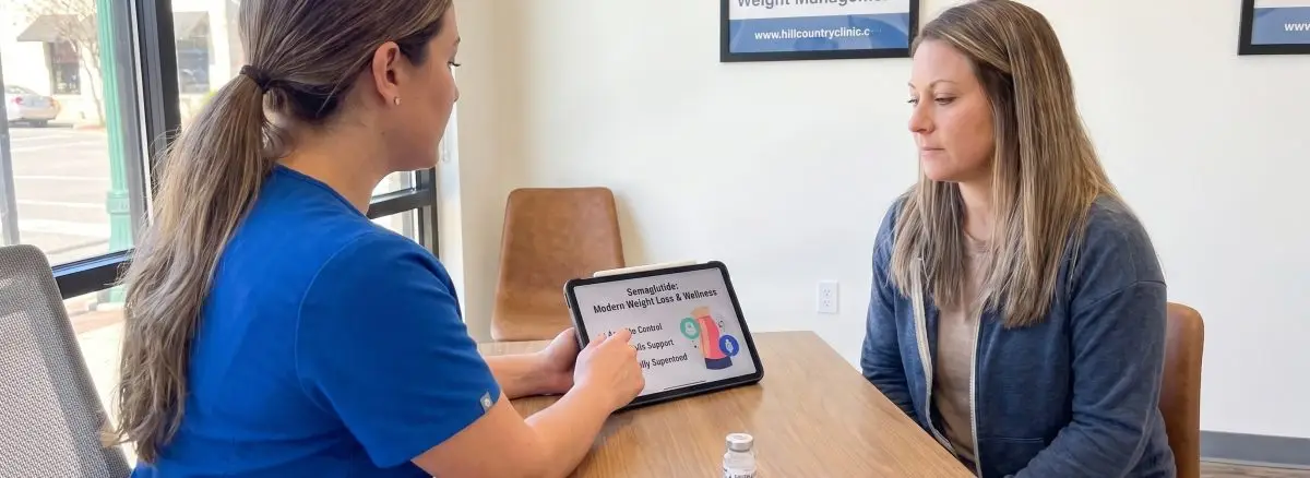 Healthcare provider discussing semaglutide medical weight loss treatment with a patient in New Braunfels, TX.
