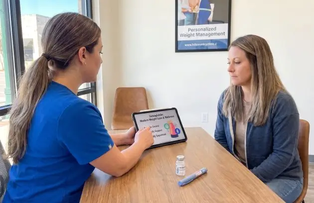 Healthcare provider discussing semaglutide medical weight loss treatment with a patient in New Braunfels, TX.